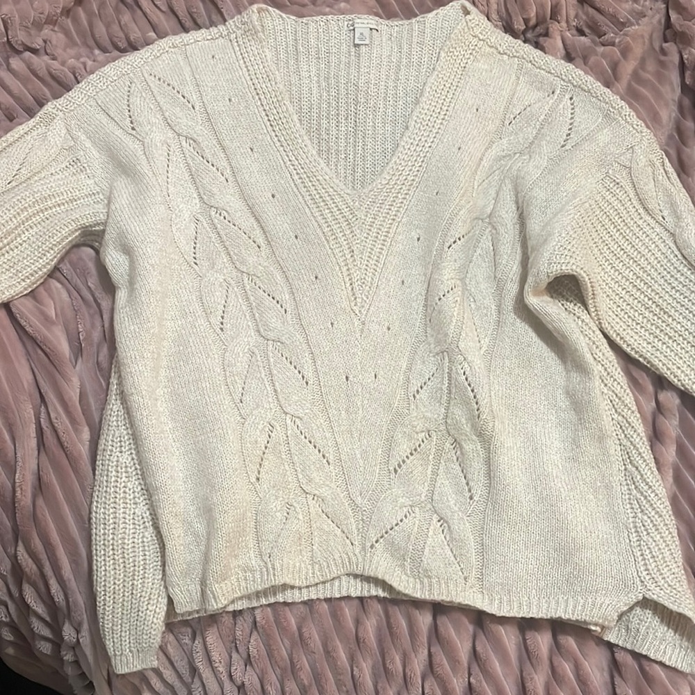 Oversized cream colored Cato brand sweater.